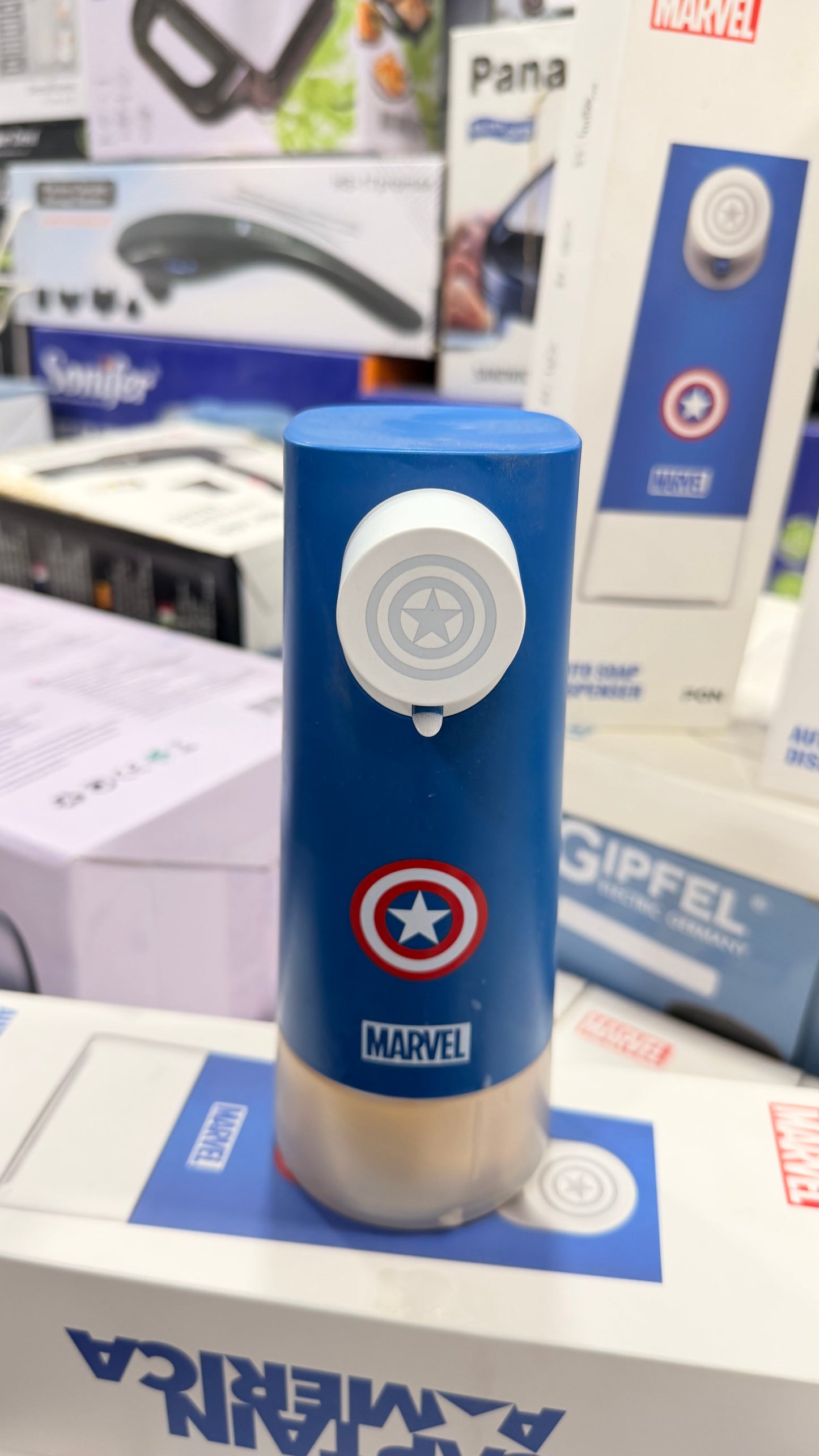 Close-up of soup dispenser control button and base